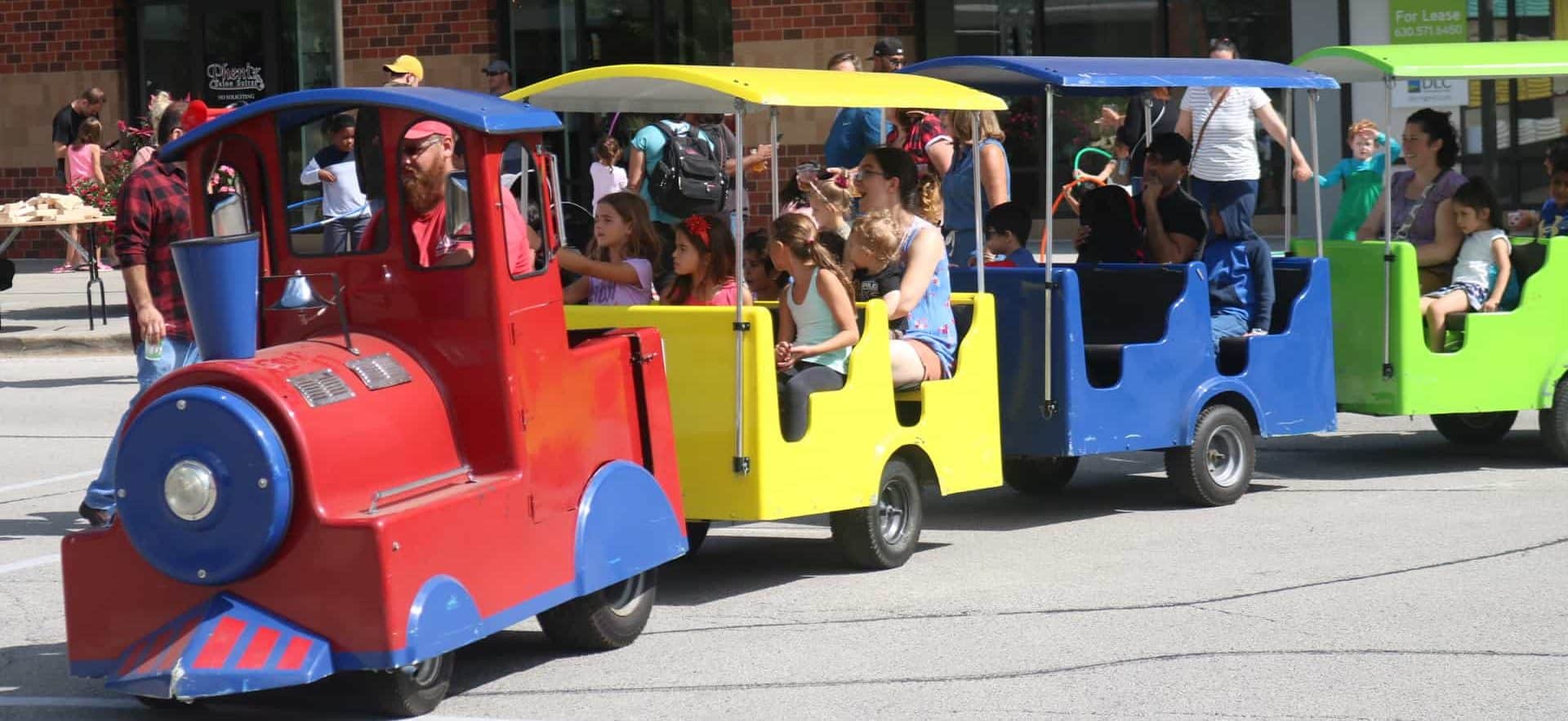 Children and parents on a colorful train ride