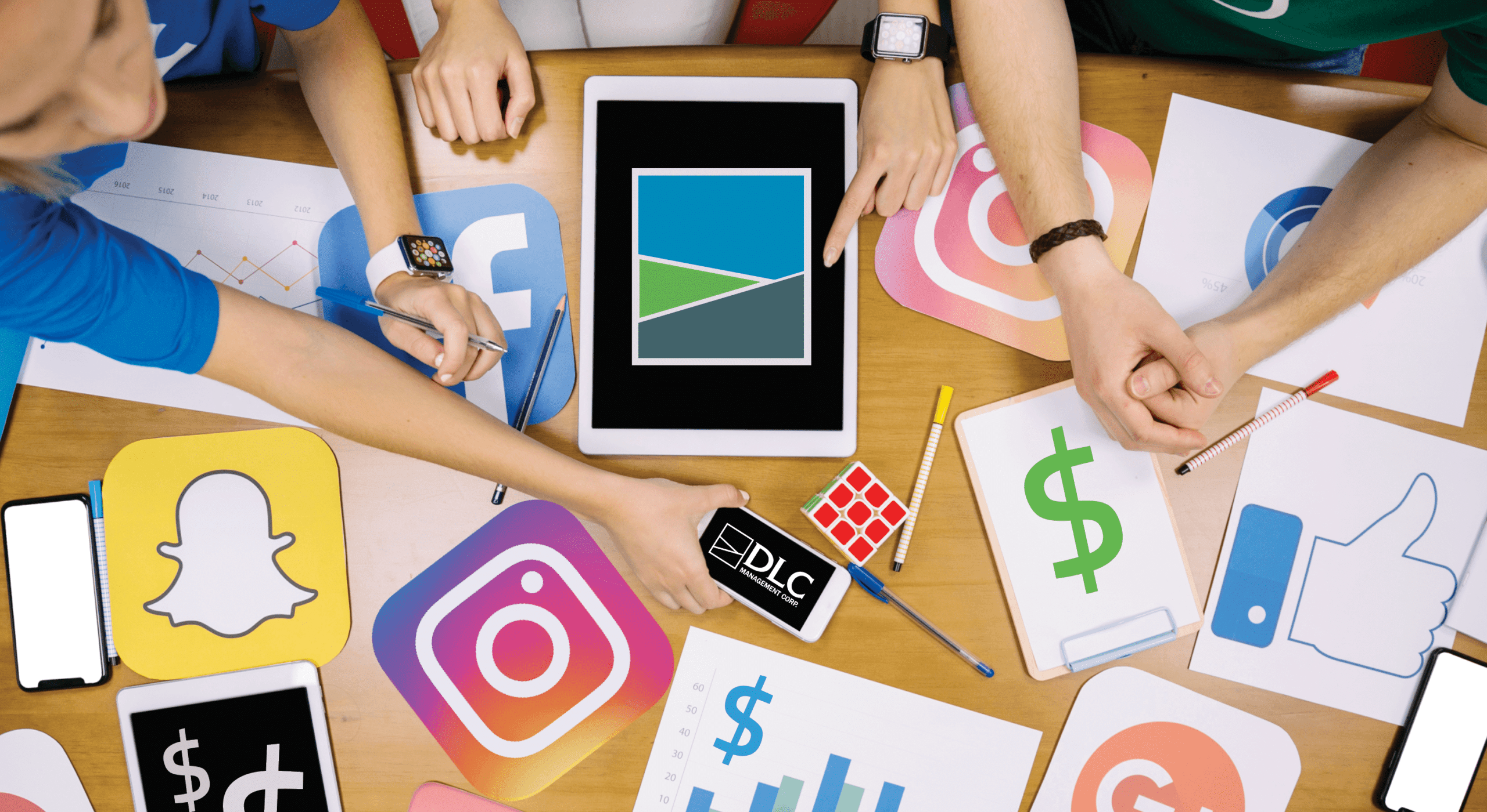 Three people sitting around a table with social media logos scattered around