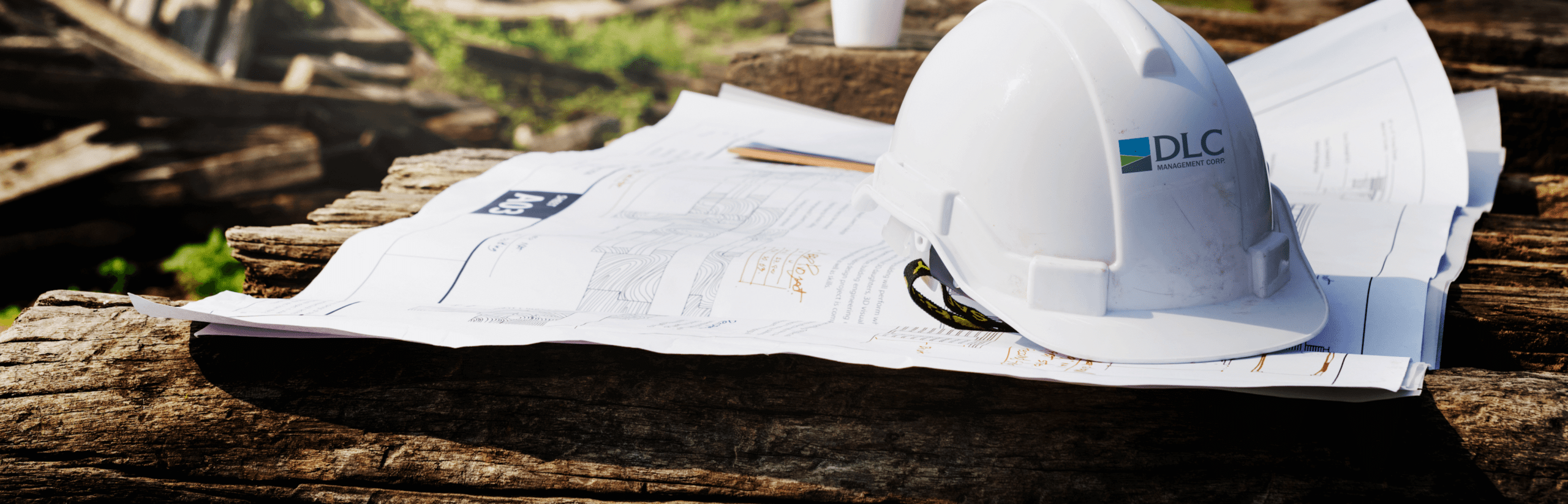 Construction hard hat placed on top of papers
