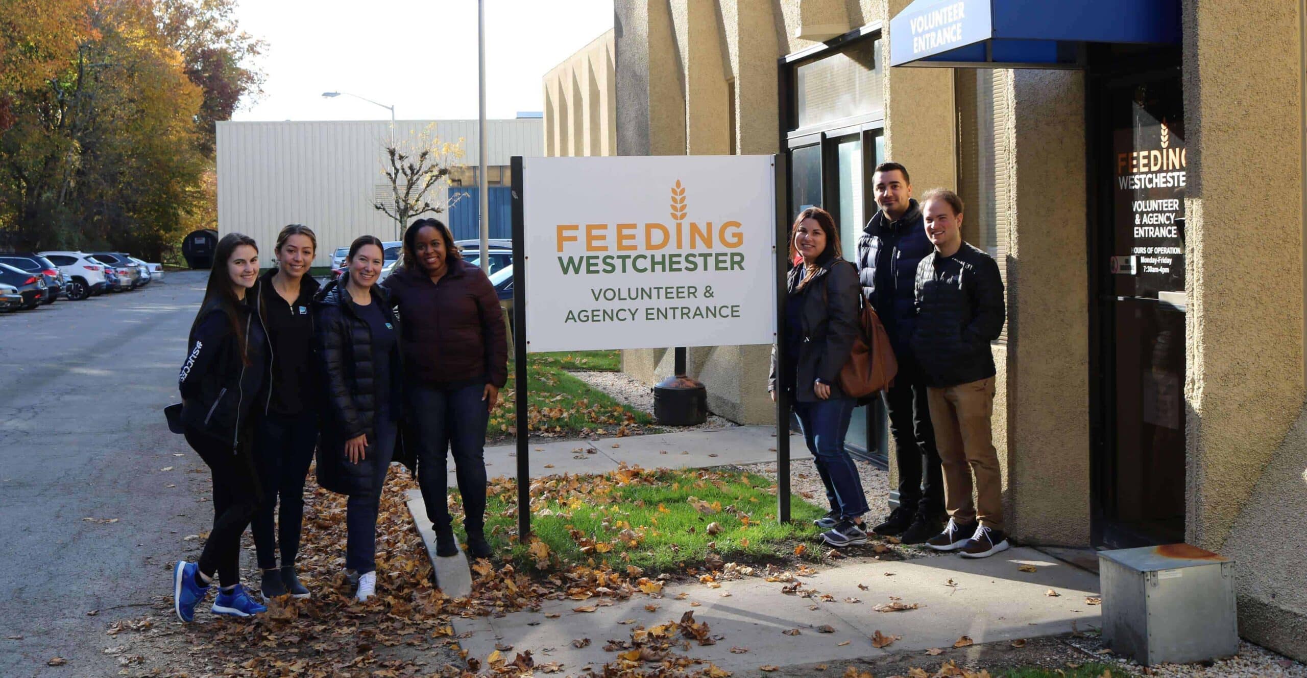 Group of people standing outside of Feeding Westchester